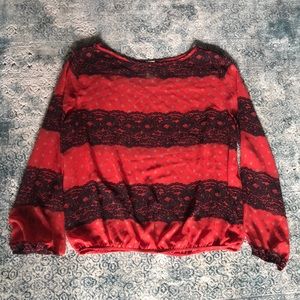 Red tunic with black lace pattern. Size M.